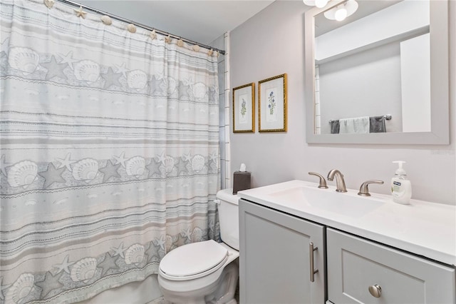 bathroom with toilet, vanity, and a shower with shower curtain