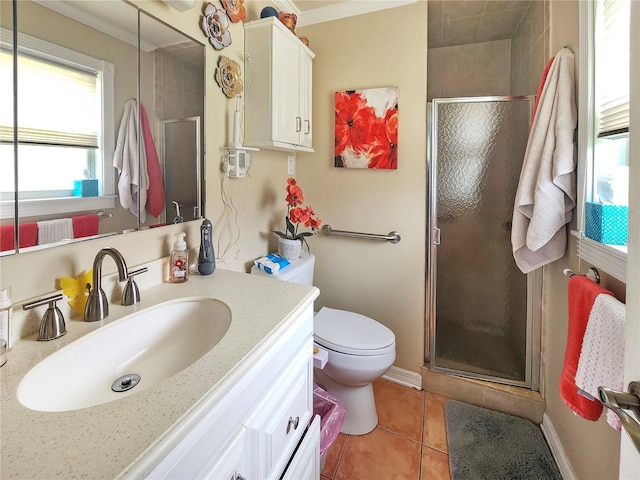 bathroom featuring a shower with door, crown molding, toilet, tile patterned floors, and vanity