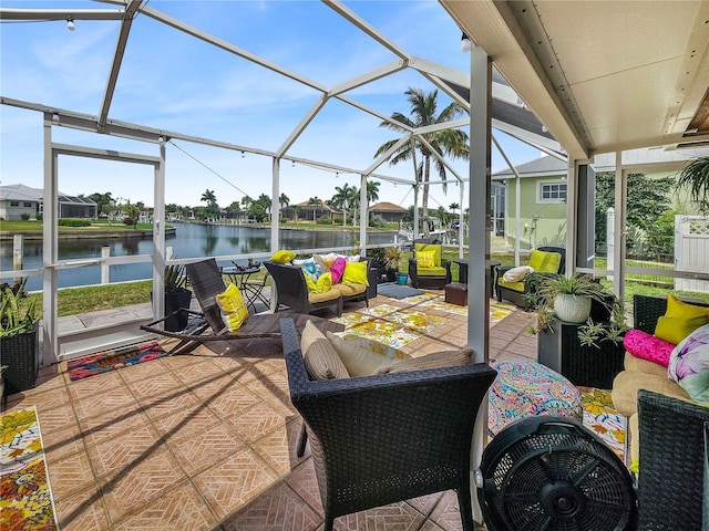 view of patio with a residential view, a water view, a lanai, and an outdoor living space