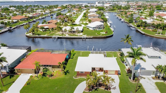 drone / aerial view featuring a residential view and a water view