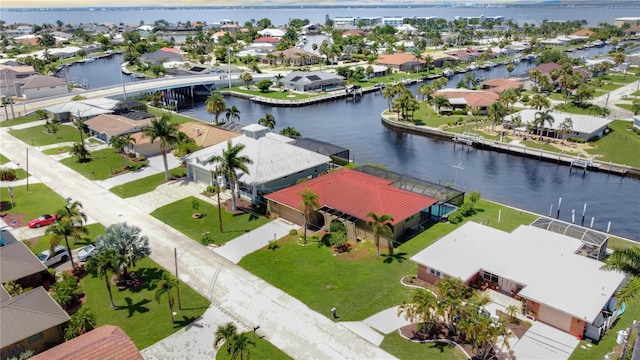 bird's eye view with a water view and a residential view