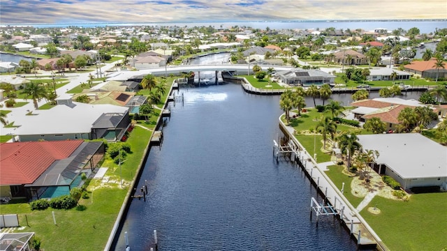 birds eye view of property featuring a water view and a residential view