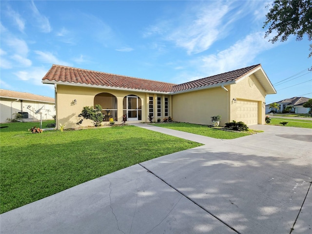 view of front of property with a garage and a front yard