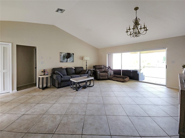 living room featuring light tile patterned flooring, lofted ceiling, and a notable chandelier