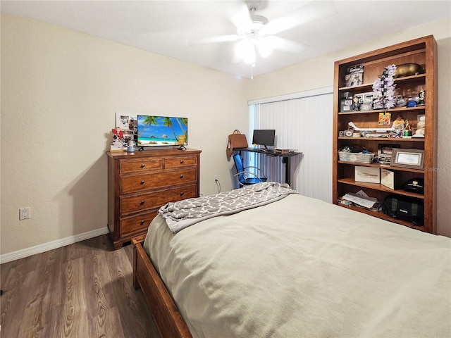 bedroom featuring ceiling fan, wood-type flooring, and a closet