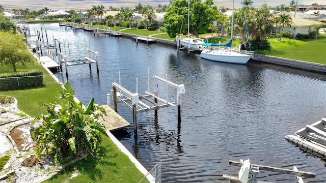 695 Coronado Dr, Punta Gorda, FL 33950 - dock area with boat lift, a yard, and a water view