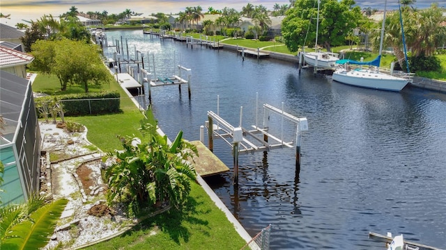 695 Coronado Dr, Punta Gorda, FL 33950 - view of dock with a lanai, boat lift, a residential view, and a water view
