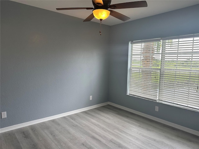 unfurnished room featuring ceiling fan and light hardwood / wood-style floors