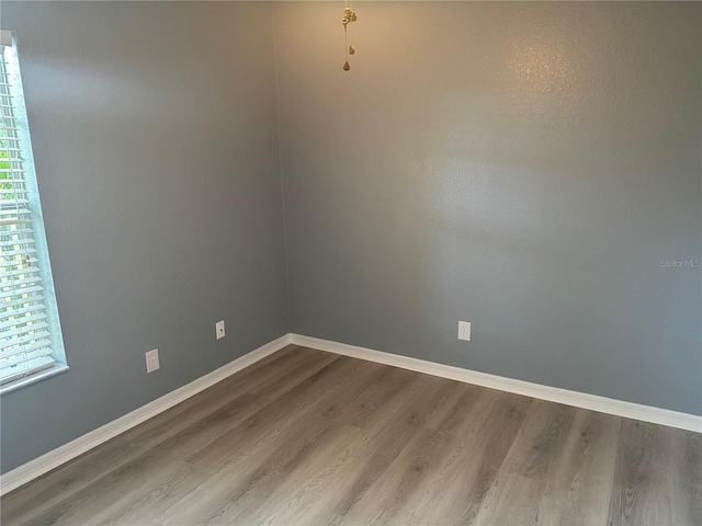 unfurnished room featuring hardwood / wood-style floors