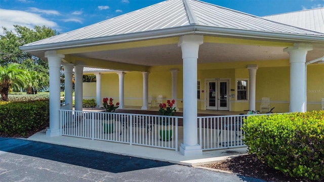 exterior space with french doors and a porch