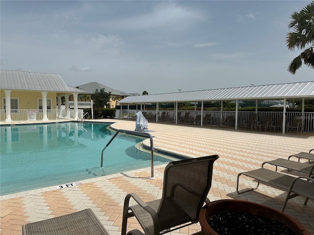 view of swimming pool with a patio area