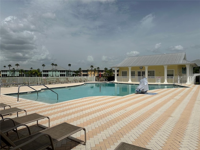 view of swimming pool featuring a patio