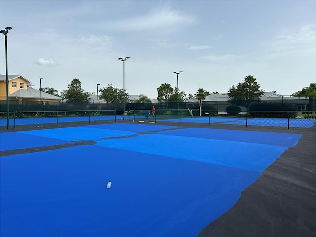 surrounding community with tennis court