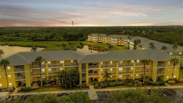 aerial view at dusk with a water view