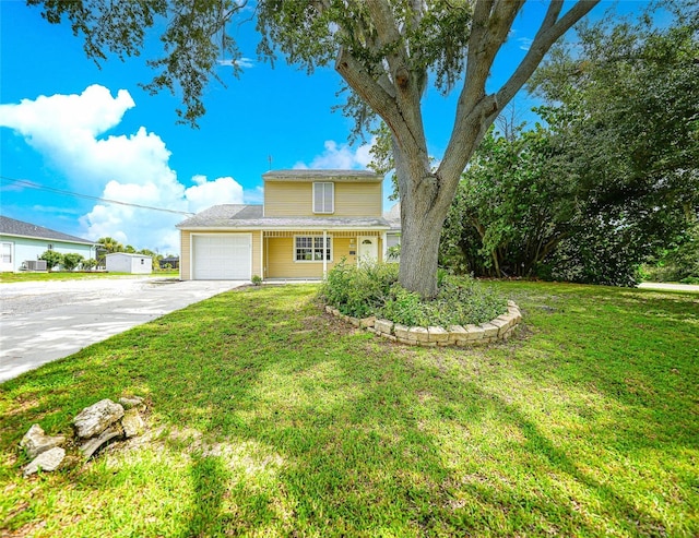 view of front facade with a garage and a front yard