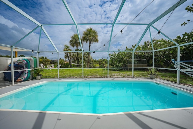 view of pool featuring a yard and a lanai