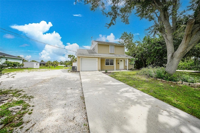 front facade with a garage and a front yard