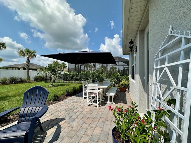 view of patio / terrace with glass enclosure