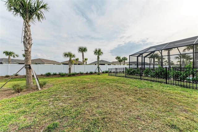 view of yard featuring a lanai