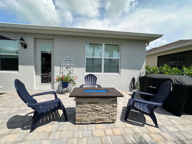 view of patio with a fire pit and grilling area