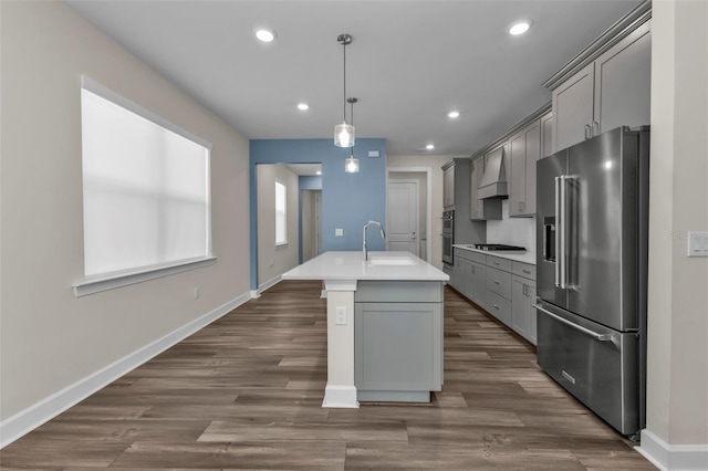 kitchen with sink, gray cabinets, hanging light fixtures, and stainless steel appliances