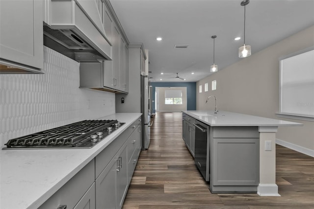 kitchen with sink, premium range hood, gray cabinetry, and stainless steel appliances