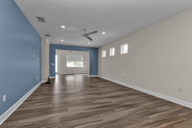 spare room featuring ceiling fan and dark hardwood / wood-style flooring