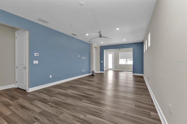 empty room featuring ceiling fan and dark hardwood / wood-style floors