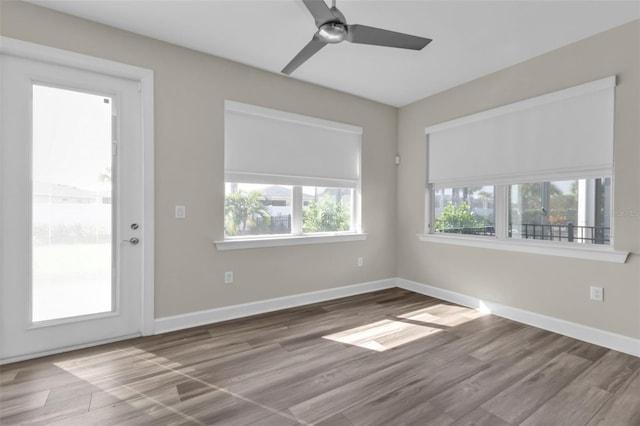 spare room with ceiling fan and hardwood / wood-style floors