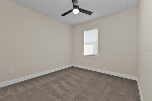 unfurnished room featuring ceiling fan and carpet flooring