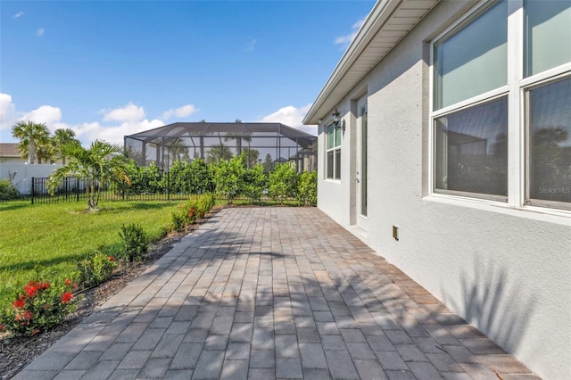 view of patio / terrace with a lanai