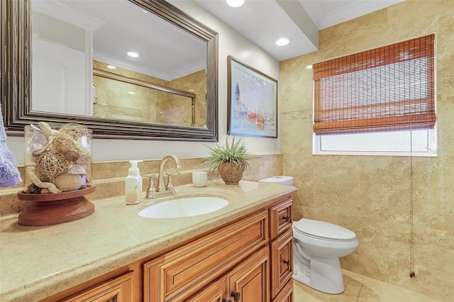 bathroom featuring vanity, tile walls, toilet, and tile patterned flooring