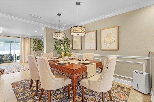 dining area featuring light tile patterned flooring and ornamental molding