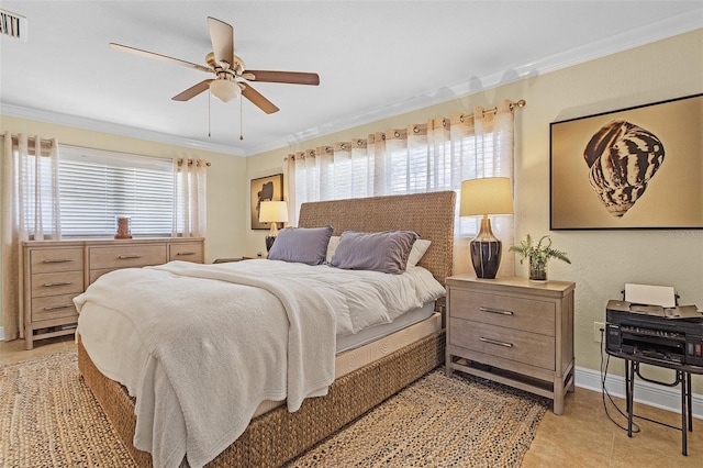 tiled bedroom featuring ornamental molding and ceiling fan