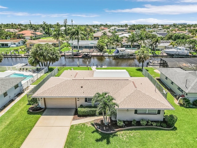 birds eye view of property with a water view