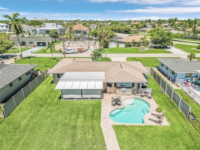 view of pool featuring a patio and a lawn