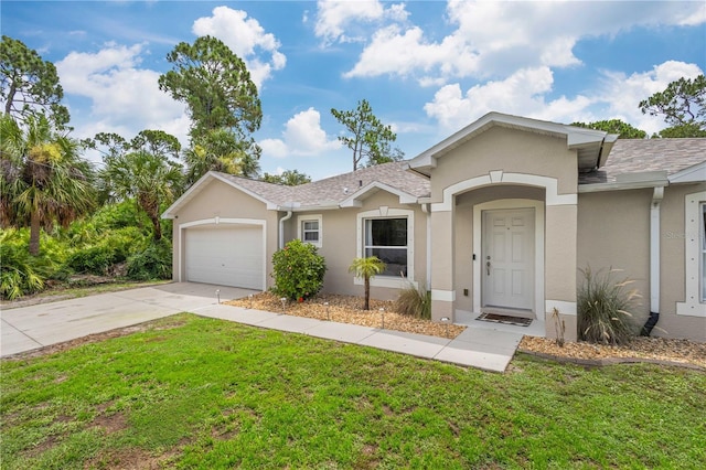 single story home with a garage and a front lawn