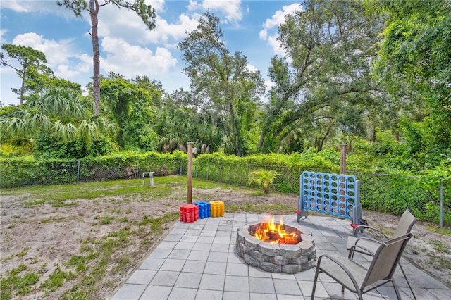 view of patio / terrace featuring an outdoor fire pit