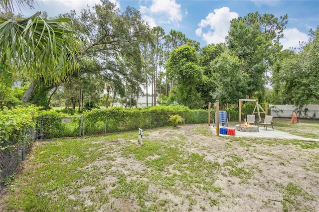 view of yard with an outdoor fire pit