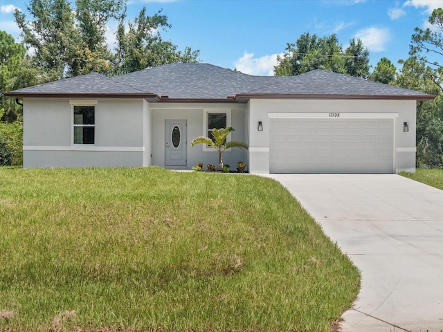 view of front facade featuring a front yard and a garage