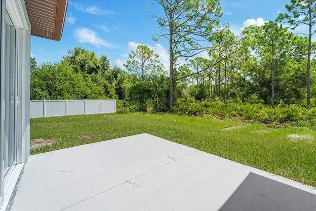 view of patio / terrace featuring fence