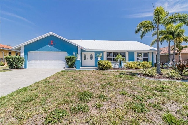 ranch-style home with a garage and a front yard