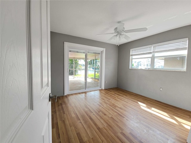 spare room with a ceiling fan and wood finished floors