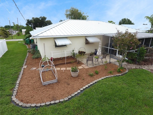 rear view of house with a lawn