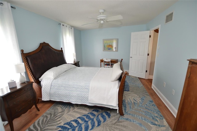 bedroom featuring ceiling fan and hardwood / wood-style flooring