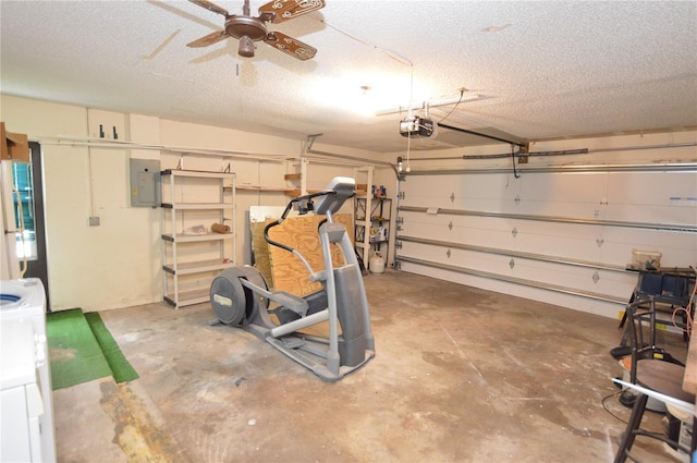 garage featuring ceiling fan, white fridge, washer / dryer, electric panel, and a garage door opener