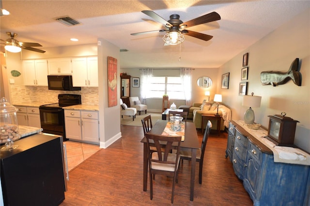 dining area featuring light wood-type flooring and ceiling fan