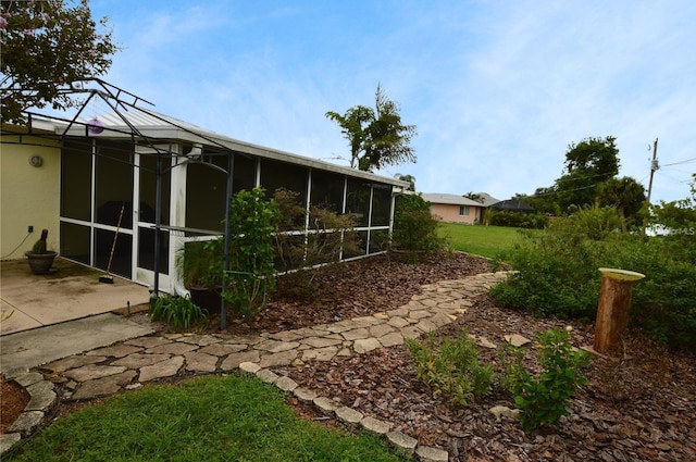 view of yard featuring a sunroom