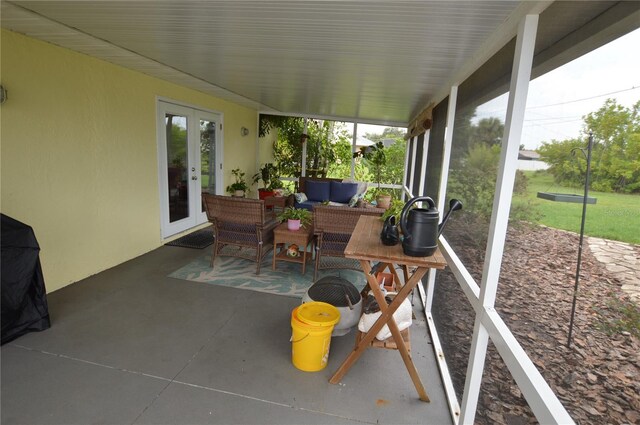 sunroom featuring french doors