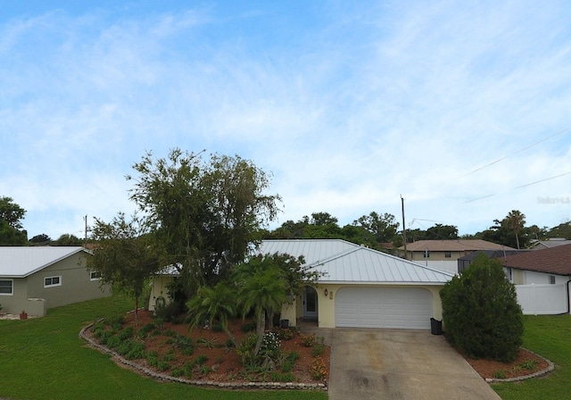 ranch-style home with a garage and a front lawn